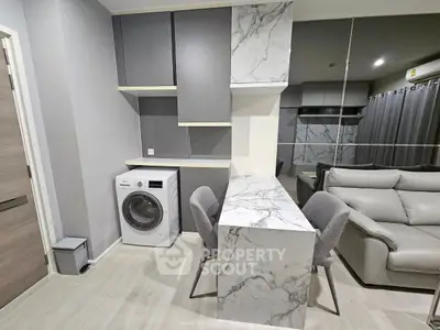 Modern living room with marble accents and built-in washing machine