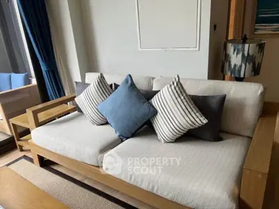 Stylish living room with modern sofa and elegant decor in a bright, inviting space.