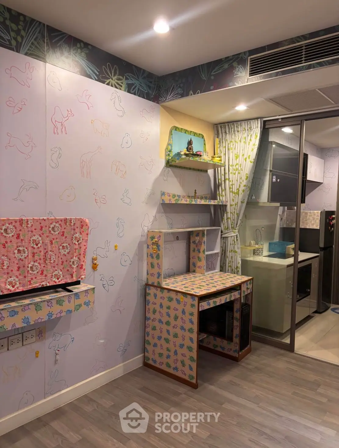 Charming kitchen with colorful decor and modern appliances in a cozy apartment setting.