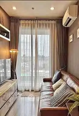 Cozy living room with modern decor and large window view