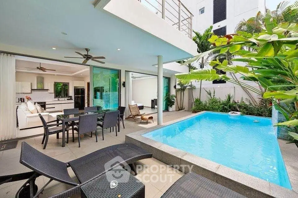 Luxurious modern villa with private pool and spacious outdoor living area.
