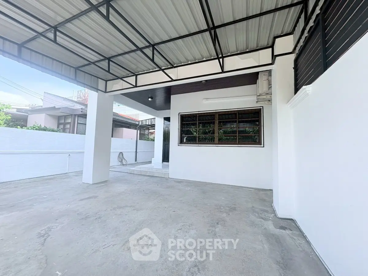 Spacious covered parking area with modern design and ample natural light