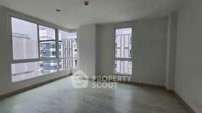 Spacious corner unit with large windows offering city views, perfect for natural light lovers.