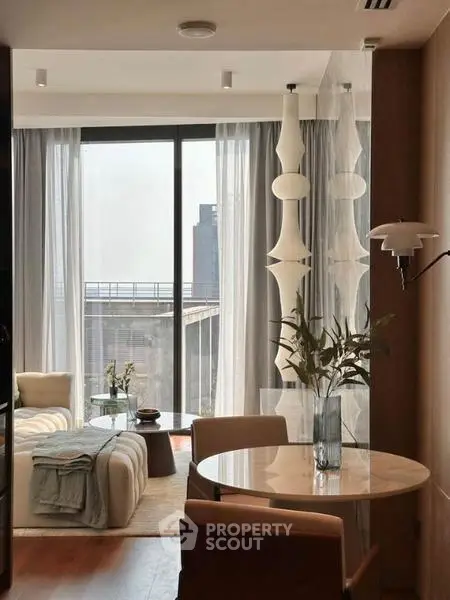 Stylish modern living room with floor-to-ceiling windows and elegant decor