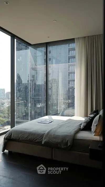 Luxurious bedroom with floor-to-ceiling windows offering stunning city views.