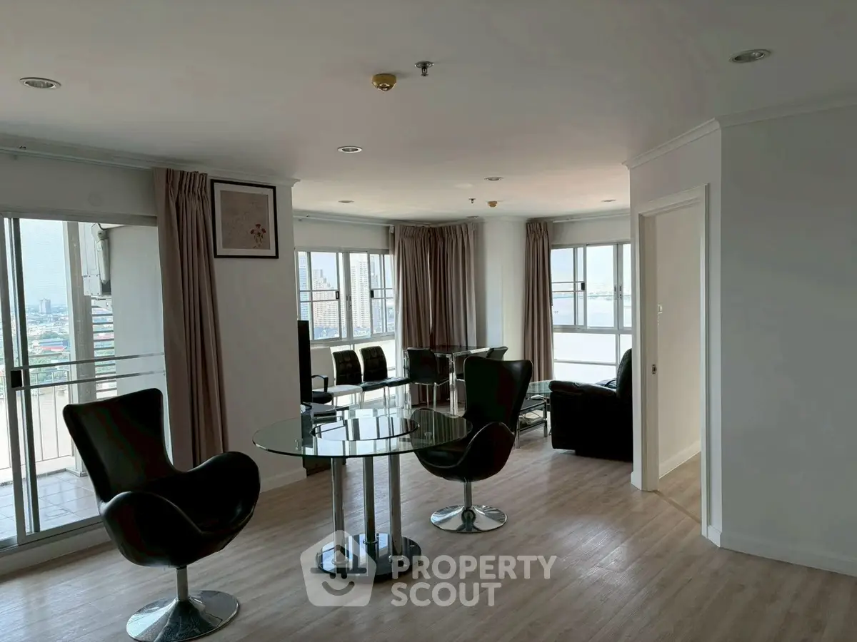 Spacious modern living room with city view and stylish furniture