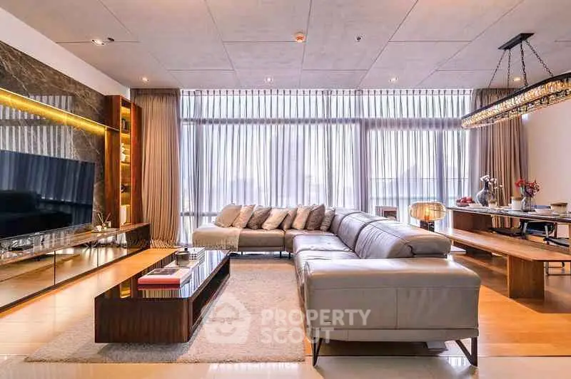 Luxurious modern living room with large sectional sofa and elegant decor