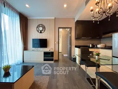 Modern living room with elegant decor and open kitchen layout