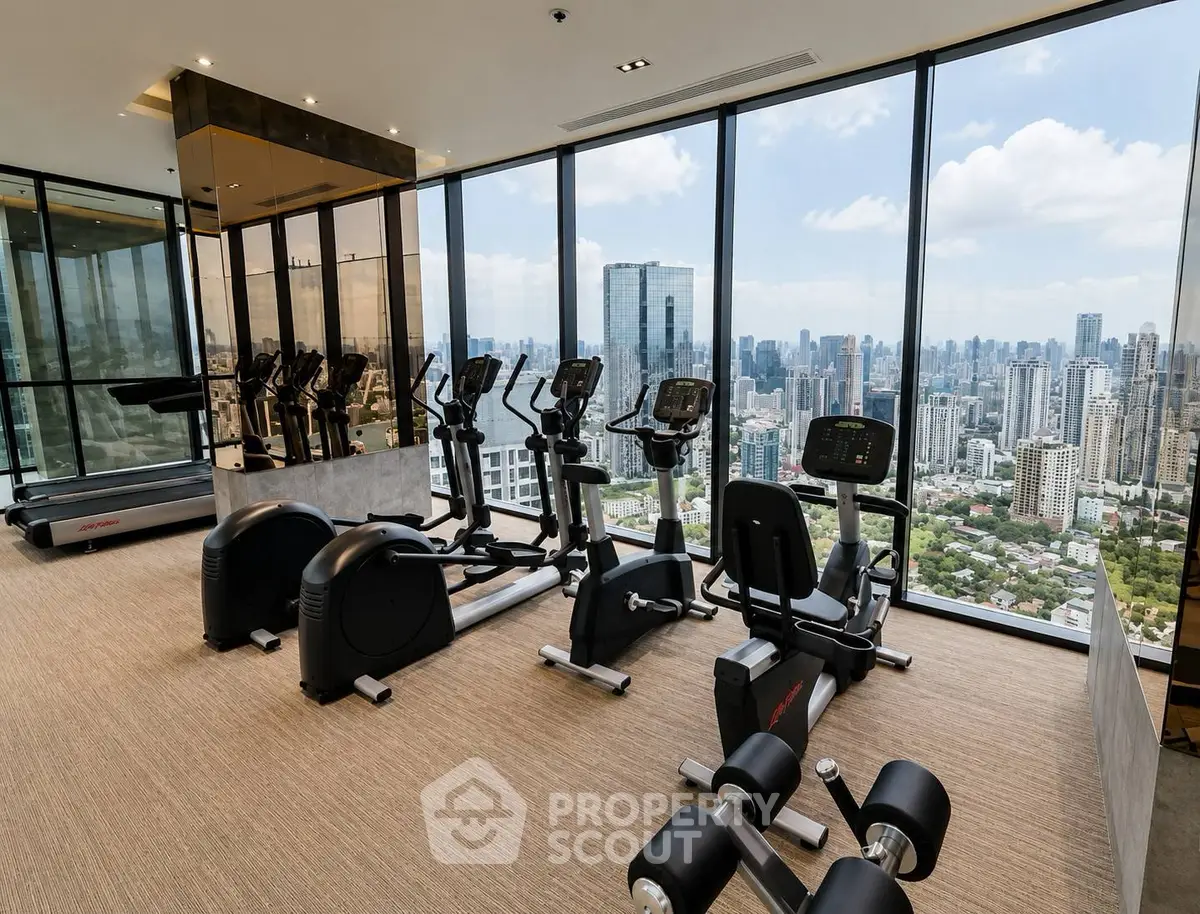 Luxurious high-rise gym with panoramic city views and modern fitness equipment.