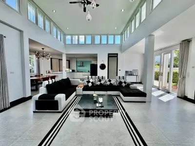 Spacious modern living room with high ceilings and ample natural light