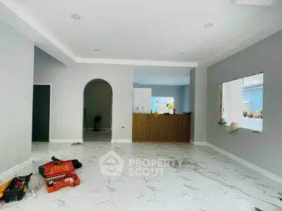 Spacious modern living room with marble flooring and open layout