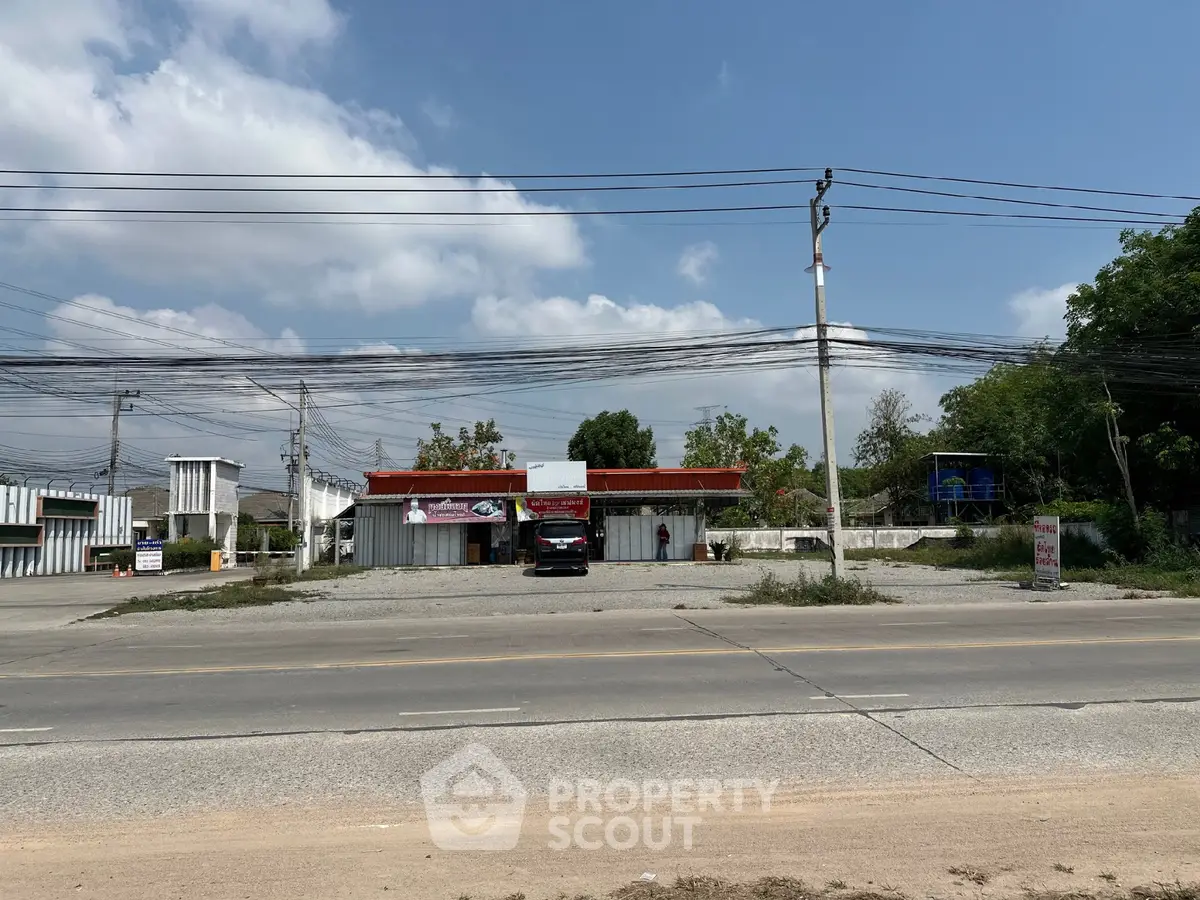 Commercial property with ample parking space on a sunny day