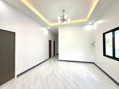 Spacious modern living room with elegant lighting and sleek flooring