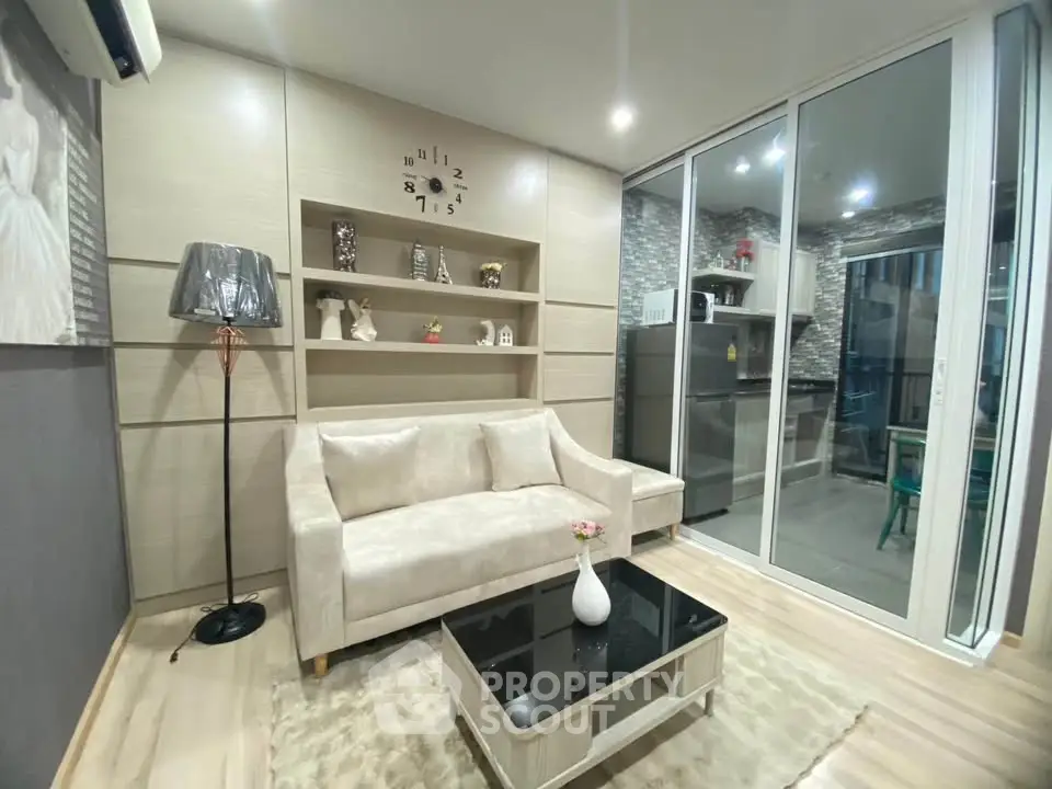 Modern living room with elegant decor and open kitchen layout