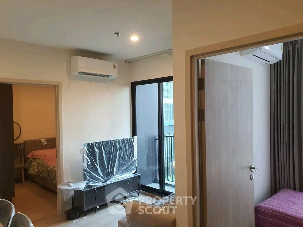 Modern apartment living room with balcony and air conditioning