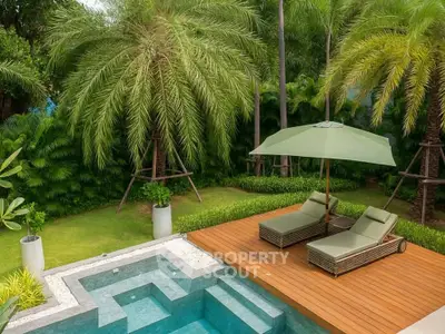 Luxurious tropical poolside oasis with lush greenery and stylish sun loungers.