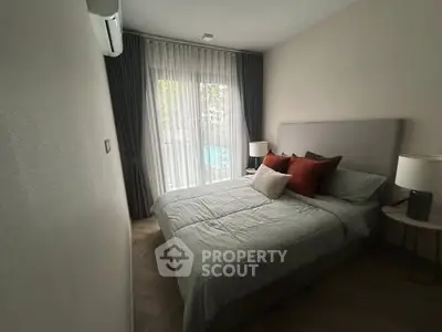 Cozy bedroom with modern decor and large window view