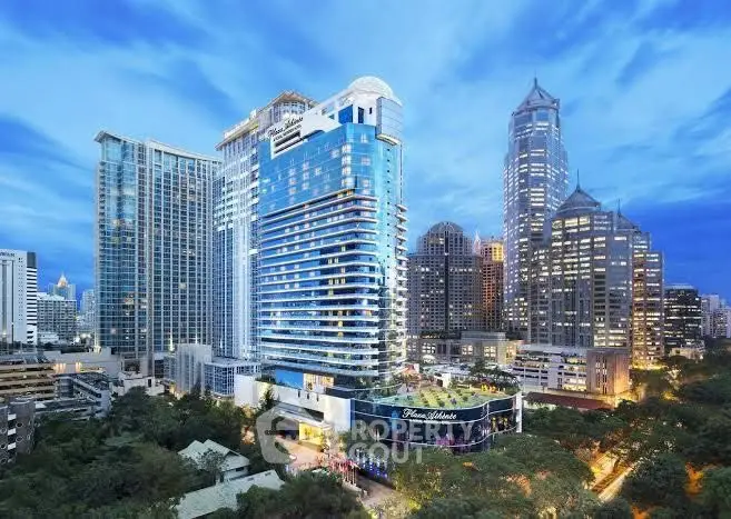 Stunning cityscape view of modern high-rise buildings with lush greenery and vibrant skyline.