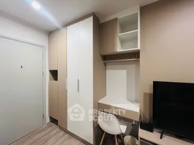 Modern study area with built-in storage and sleek design in a compact apartment.