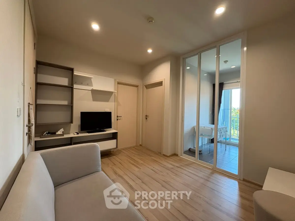Modern living room with sleek design and balcony view