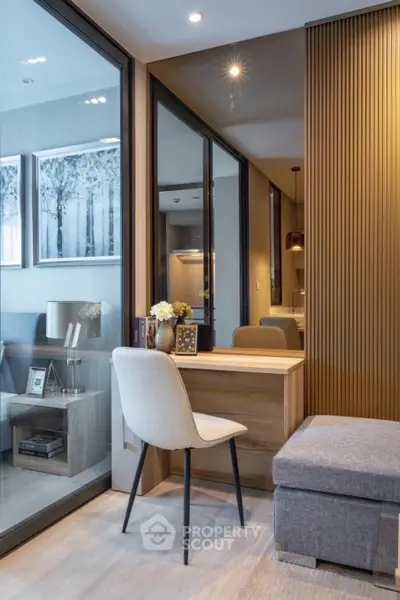 Modern study nook with elegant chair and wooden desk in stylish apartment