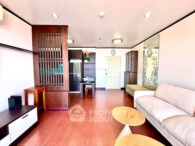 Spacious living room with modern furniture and elegant wooden accents