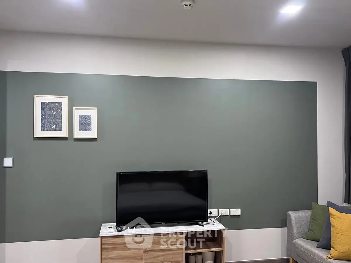 Modern living room with stylish decor and flat-screen TV