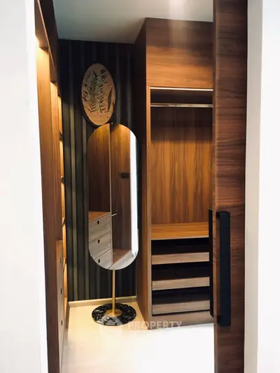 Luxurious walk-in closet with elegant wood finish and modern design