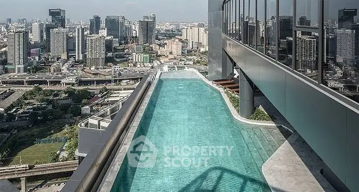Stunning rooftop pool with breathtaking city skyline view, perfect for luxury urban living.
