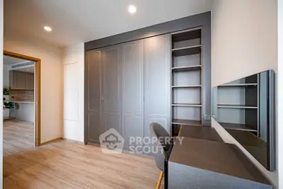 Modern study room with sleek built-in storage and desk, perfect for productivity.