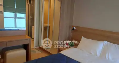 Cozy bedroom with ensuite bathroom and modern furnishings