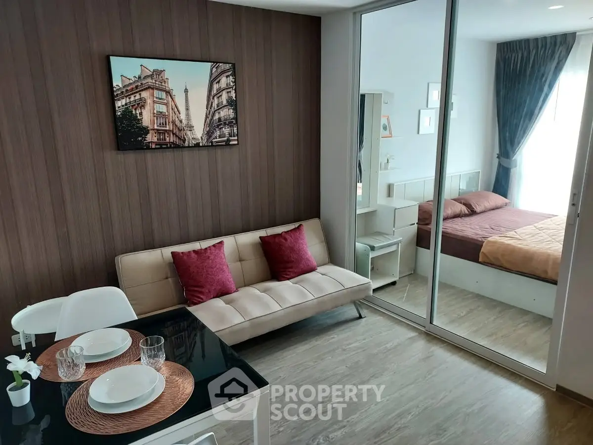 Modern studio apartment with stylish decor and mirrored wardrobe