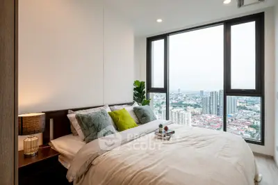 Luxurious bedroom with stunning city view and modern decor