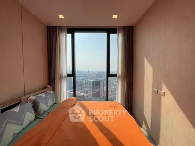 Stunning bedroom with floor-to-ceiling window offering breathtaking city skyline views.