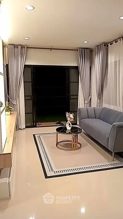 Elegant living room with modern sofa and stylish decor, perfect for cozy evenings.