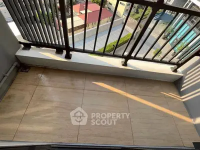 Charming balcony with city view, perfect for relaxation and enjoying the urban landscape.