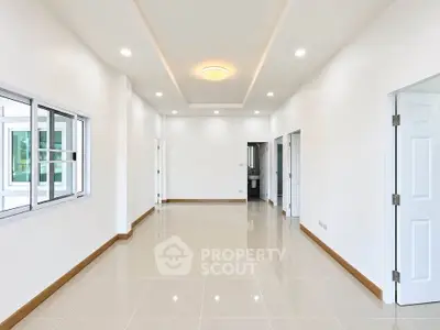Spacious and bright interior with modern finishes and sleek tile flooring, perfect for customization.
