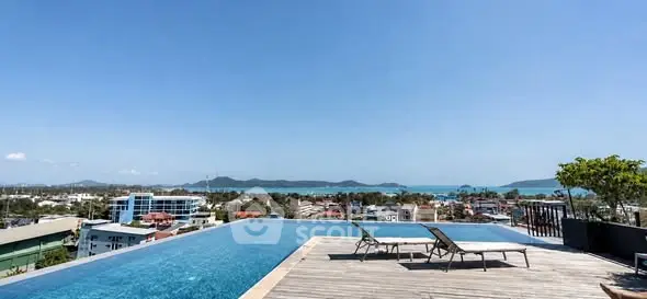 Stunning rooftop infinity pool with panoramic ocean and city views.