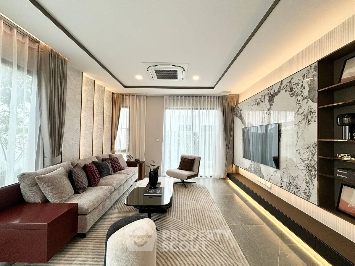 Luxurious modern living room with elegant decor and large windows