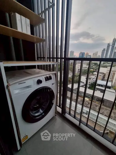 Modern balcony with city view and washing machine setup