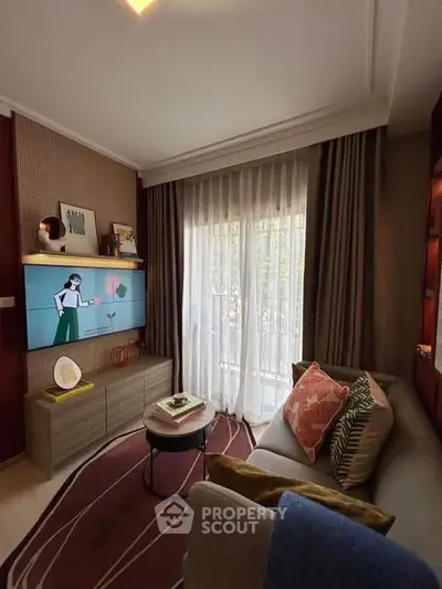 Cozy living room with modern decor and balcony view, featuring stylish furniture and elegant curtains.