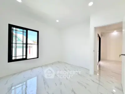 Bright and spacious room with modern white marble flooring and large window