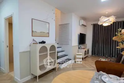 Charming modern living room with stylish decor and cozy ambiance, featuring elegant furniture and contemporary lighting.