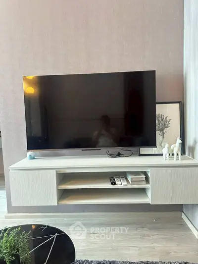 Modern living room with wall-mounted TV and stylish decor