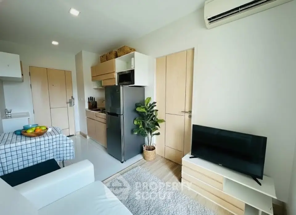 Modern apartment interior with open kitchen and cozy living area