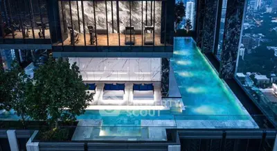 Luxurious rooftop pool with stunning city view and modern gym facilities in high-rise building.