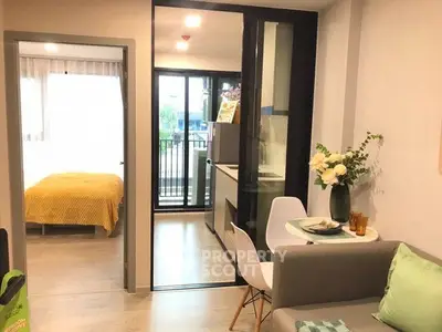 Modern apartment interior with cozy living room and kitchen, bright bedroom view.