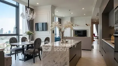 Luxurious open-plan living room with elegant dining area and city view.