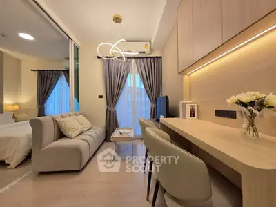 Modern living room with elegant decor and cozy seating area, perfect for relaxation and entertainment.