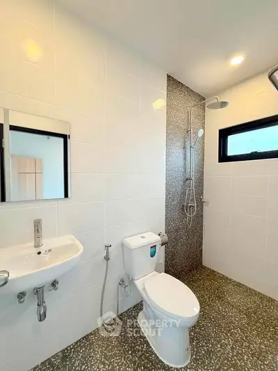 Modern bathroom with sleek fixtures and stylish shower area